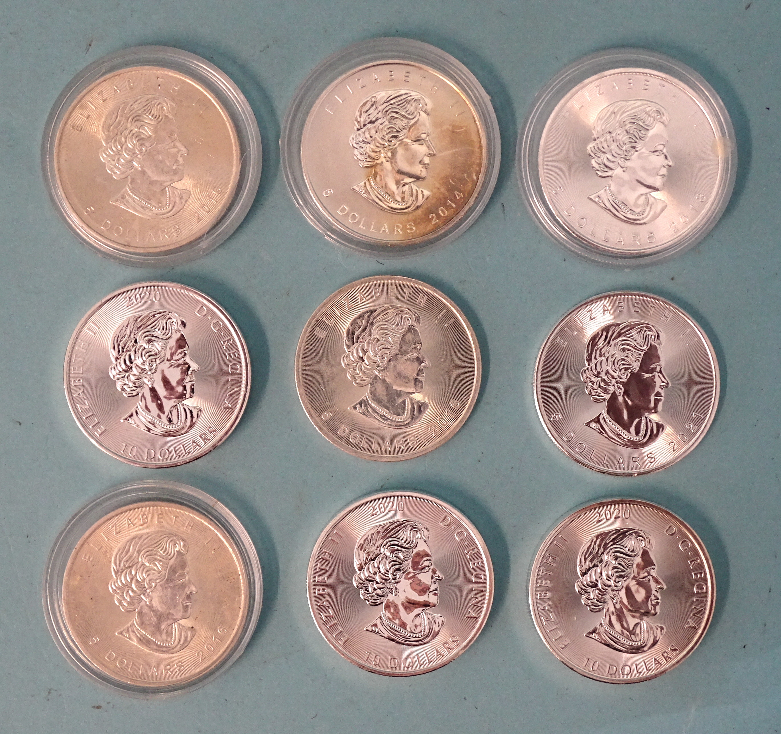 A collection of nine Canada silver bullion coins: three 'The Kraken' ten-dollar coins and six 'Maple - Bild 2 aus 2