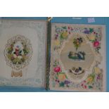 An Addenbrooke Valentine of a wreath of applied silk and paper flowers within paper lace border,
