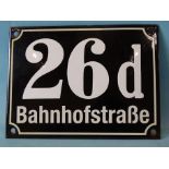 A German enamelled house sign "26d Bahnhofstraße", white font on black background, 15 x 20cm.