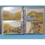 An album of 136 artist-drawn A R Quinton postcards, UK views, including some Devon and Cornwall.