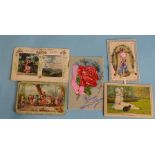 A small French fold-out tableau card of a bride and groom, another of an Eastern scene and three