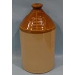 A stoneware flagon, partially honey-glazed, impressed on top "Octagon Brewery Plymouth", 42cm tall.