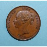 A Queen Victoria 1858 copper one-penny coin.