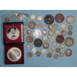 A collection of British and world coinage, including a quantity of silver coins and a Danbury Mint