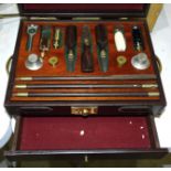 A set of 12-bore shotgun cleaning equipment, including William Powell snap caps, oil bottles,