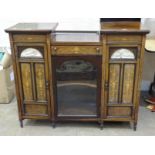 A rosewood side cabinet with inlaid decoration, fitted with central drawer above a glazed door