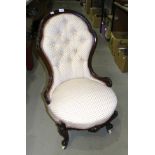 A late-19th century stained wood frame upholstered button-back and seat salon chair on carved shaped