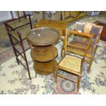 An Edwardian mahogany circular three-tier dumb waiter with detachable glass-bottomed two-handled