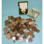 A collection of world postage stamps in albums and loose, together with a quantity of coins.