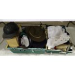 A vintage motorcycle helmet, a military water bottle, military hats, a Sam Browne belt and