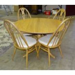 An Ercol 'Chester' light elm and beech extending dining table on pedestal and quadruped support, 119