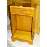 A modern yew wood bedside cupboard fitted with a single drawer, 44cm wide, 75cm high, together