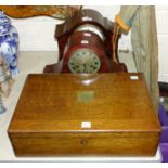 A mahogany-cased gong-striking mantel clock, a mahogany arched mantel clock, a cutlery canteen (
