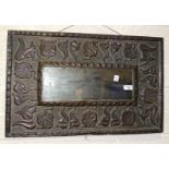 A rectangular copper Arts & Crafts-style mirror, 45 x 71cm, mirror plate 13.5 x 40cm.