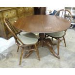 An Ercol 'Chester' dark elm pedestal extending dining table, 109 x 98cm closed, 147 x 98cm with