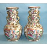 A good pair of 19th century Chinese Cantonese baluster vases with applied gilt dragon handles and