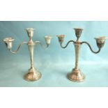 A pair of short loaded silver two-branch candelabra, Birmingham 1964, 22cm high.