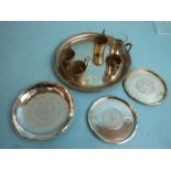 A Continental white metal circular tray with beaded rim, 16cm diameter, five matching holders for