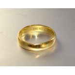 A 22ct gold wedding band, size P½, 4.8g.