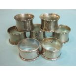 Five silver napkin rings, Birmingham 1944, together with two napkin rings marked .925 sterling