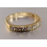 A 9ct gold half-eternity ring set seven brilliant-cut diamonds, size Q, 2.5g.