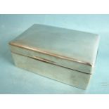 A plain rectangular silver cigarette box, the hinged lid with inscription, London 1903, 14cm wide.