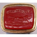 An early-19th century fob seal, the cornelian intaglio carved with a retriever below the motto