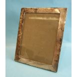 A silver photograph frame of plain rectangular form, 24 x 19cm, Birmingham 1918.