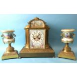 A French gilt metal and ceramic clock garniture, the painted enamel dial depicting two lovers and