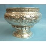 A late-Victorian silver rose bowl with embossed foliate decoration, wings and animal heads, on