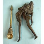 A bronze betel nut cutter in the form of two lovers embracing, 19cm and a bronze incense spoon,