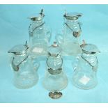 Five George V silver-topped glass whisky tot jugs by Hukin & Heath, 10cm high, three Birmingham