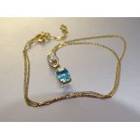 A 9ct yellow gold pendant set oval blue zircon and synthetic white stones, on 9ct gold neck chain,