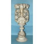 A Late Victorian alabaster ornamental vase carved with vines and raised on a socle 84cm.