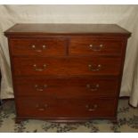 An Edwardian inlaid mahogany straight-front chest of two short and three long drawers on bracket-