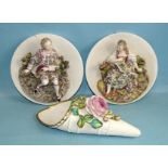 A pair of late-19th century Continental porcelain circular roundels with applied figural