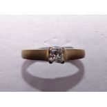 A solitaire diamond ring claw-set a princess-cut diamond of approximately 0.25cts, in 9ct yellow and