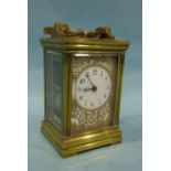 A 19th century brass repeating carriage clock with gong-striking movement stamped France, the