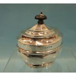A silver lidded tea caddy of oval decahedral form, 11cm high, Birmingham 1903, ___4.9oz.