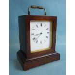 An early-19th century rosewood small mantel clock of rectangular shape, with white enamel dial and