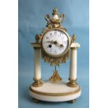 A 19th century French white marble and gilt metal portico clock, the drum bell-striking movement