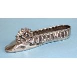 A Russian silver ballet shoe with frilled border and applied pom-pom, marks for St Petersburg and
