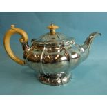 A George IV silver teapot of compressed form, with ivory finial and handle, London 1826, maker BP,