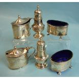 A six-piece silver cruet set, Birmingham 1938, the mustard pots and salts with blue glass liners,