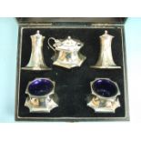 A George V cased silver five-piece cruet set, (spoons lacking), Birmingham 1923, silver weight