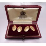 A cased pair of 15ct rose gold plain oval cufflinks, 11.7g.