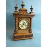 A late-19th/early-20th century walnut case mantel clock of architectural form, with 8-day gong-