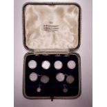 A cased set of 9ct white gold and mother-of-pearl cufflinks and dress studs, total weight 12.1g, the