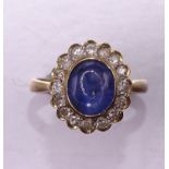 A cabochon sapphire and 8/8-cut diamond cluster ring with gold mount, marked 18k 750, size L½, 3.8g.