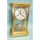 A French four-glass mantel clock with bell-striking movement and mercury-filled pendulum, 34cm high.